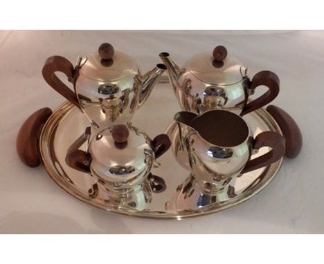 A late 20th century "Alessi Bombe" of Italy plated teaset, of plain form with polished applewood handles and lid knops, compr