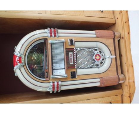 A "Rock-ola" juke box, manufactured by "Antique Apparatus - Stereo Juke Boxes of Torrance, California" (see labels verso), ha