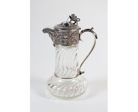 An Edwardian silver mounted glass claret jug, Mappin & Webb, London 1904, designed as a wrythen moulded glass jug with spread