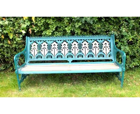 A Victorian cast iron garden bench with Aesthetic movement stylized floral panel back, with later wooden slatted seat, 1.86m 