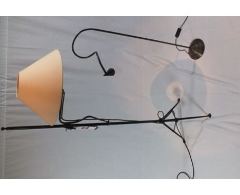 A wrought metal adjustable standard reading lamp, with plain cream shade, together with an adjustable satin brass effect read