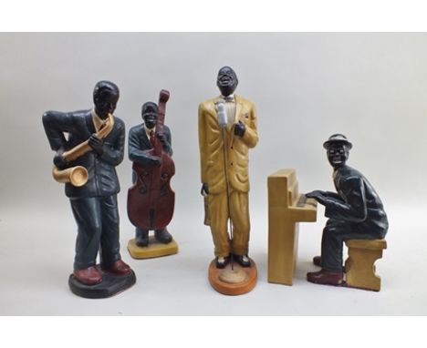 A 20th century four piece Jazz band, polychrome ceramic, singer stands 57cm high (including pianist with separate piano, sing