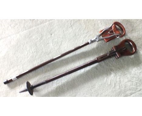 An Edwardian mahogany shooting stick with brass mechanism and steel point, 82cm overall, together with one other 