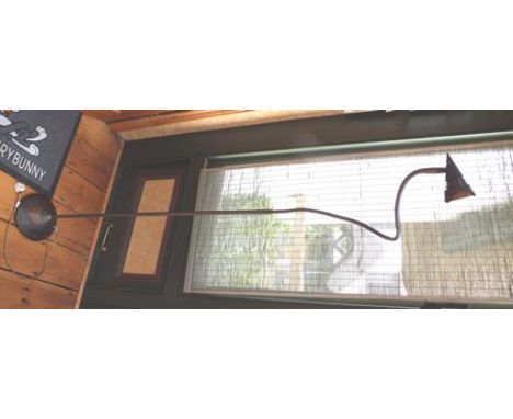 A bronzed effect adjustable standard reading lamp 