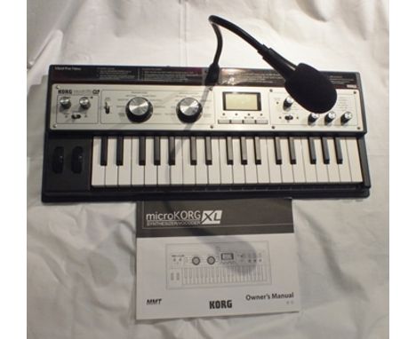 A "Korg MicroKorg" synthesizer/vocoder XL, plus owners manual 