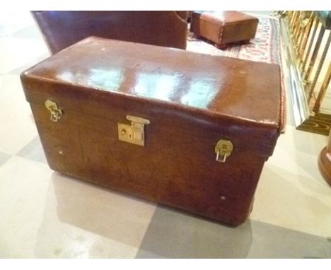 A leather boot trunk by "Peal & Co. Oxford St. London", circa 1900, of copper studded leather construction, with side carryin