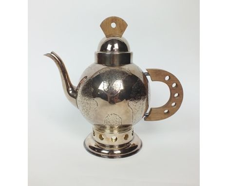 A French silver plated teapot, of circular form with textured patterned decoration, with pierced wood handle, domed removable