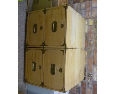 A pair of light oak campaign style two-drawer filing cabinets with brass corners and flush folding handles, 47cm wide, 65cm h