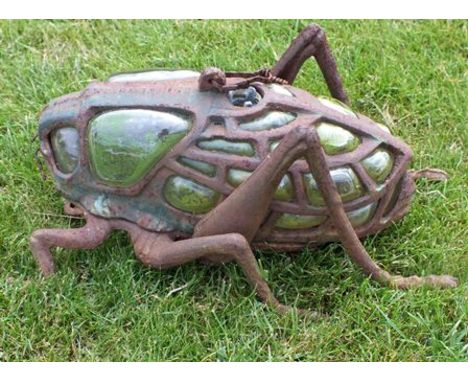 A 20th century cast iron and blown glass hanging lantern in the form of a locust, 28cm long 