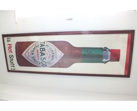 "Tabasco-is hot stuff" a 20th century print of a tabasco sauce bottle, 1.27m x 38cm, in red gloss frame, glazed, labelled ver