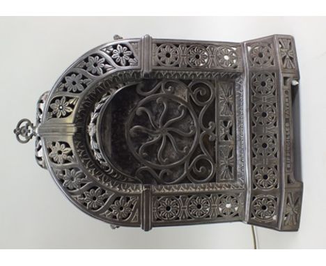 An Edwardian "Ripingilles" cast metal paraffin heater, having arch top with pierced floral decoration, fitted side handles, 5