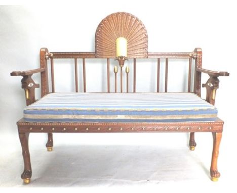 A 20th century Egyptian Revival salon suite comprising; a two seater sofa and pair of single chairs in gilded carved hardwood