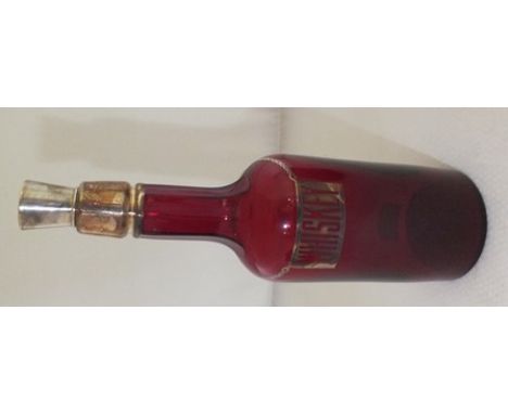A ruby glass bottle decanter, with silver resist decoration of a chain, and label with legend "Whiskey", with cork and plated