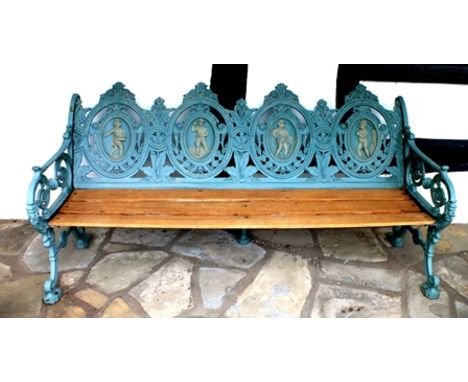 A Victorian cast iron garden bench, the back of four oval cameo panels featuring agricultural workers at harvest, painted in 
