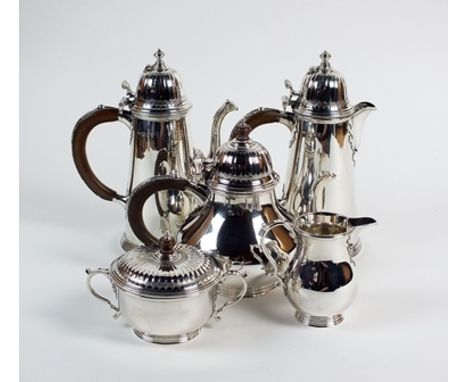 A Tiffany & Co George I style five piece silver tea and coffee service, London 1969, comprising: a circular baluster teapot w