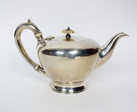 A Victorian silver teapot, Richard Pearce & George Burrows, London 1848, of plain polished tapering circular form, the silver