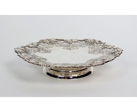A pedestal silver platter, Henry Atkin, Sheffield 1957, of shaped circular form with vine and grape decorative pierced body, 