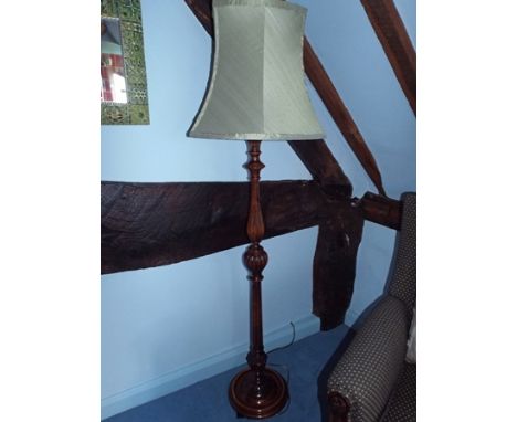 A 20th century stained wood lamp standard with tapering green shade, 173cm high overall 