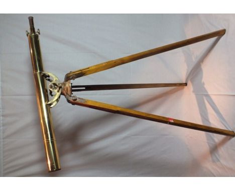 A reproduction brass telescope on wooden tripod stand, barrel 1.24m long, engraved "35 x 76 Ptd Japan" 