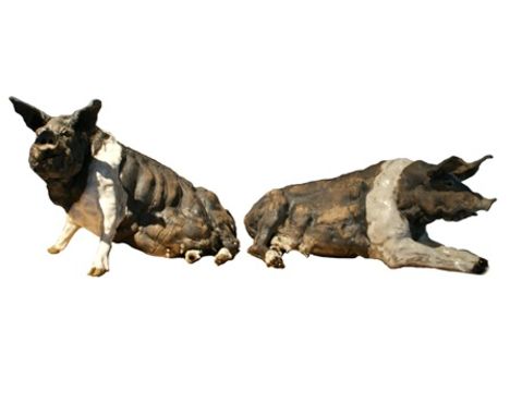Two ceramic pigs, 21cm high and 19cm high