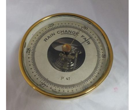 A "Taylor" of Rochester, New York, brass cased compensated barometer, with ring suspension, 13cm diameter 