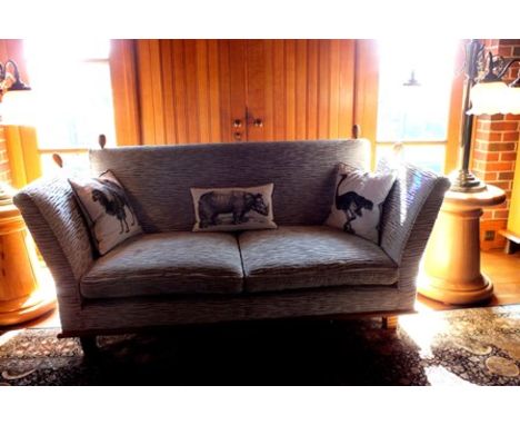 A late 20th century Knole style sofa, oak framed with turned knob decoration, upholstered in white cut on gold fabric, with t
