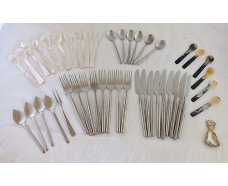 A part set of "Stellar" stainless steel cutlery, together with mother-of-pearl and horn spoons, and a caddy spoon 