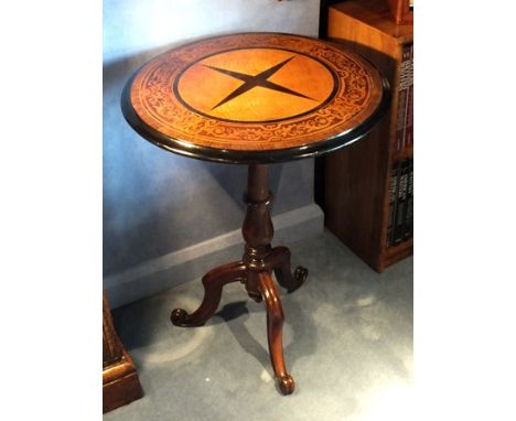 A Victorian rosewood circular tripod side table, the top with satinwood centre and ebony four point star within the inlaid me