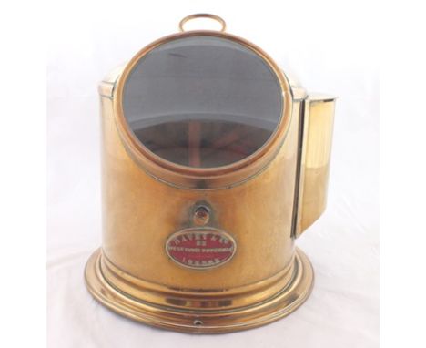 A brass binnacle cased ship's compass, bears label "Davey & Co. 88. West India Dock Road, London", circa 1900, domed cover wi