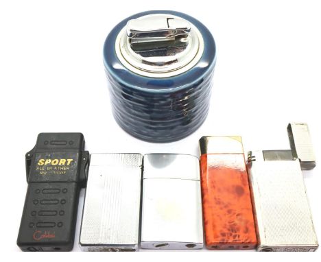 Colibri, a ceramic table lighter, with four further cigarette lighters including a windproof example. P&amp;P Group 2 (£18+VA