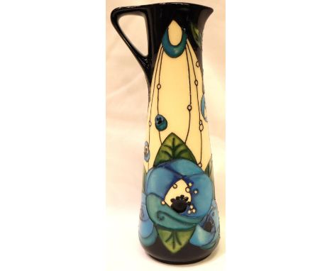 Moorcroft jug in the blue Rennie Rose pattern, H: 19 cm. P&P Group 2 (£18+VAT for the first lot and £3+VAT for subsequent lot
