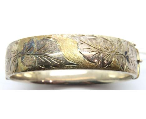 Hallmarked silver snap bangle with gilt and incised decoration, 33g. P&P Group 1 (£14+VAT for the first lot and £1+VAT for su