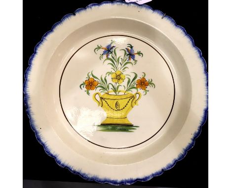 A 19th Century Italian Faience wall plate, with scalloped rim and floral painted panel, D: 34 cm. P&amp;P Group 3 (£25+VAT fo