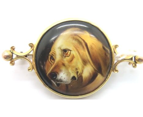 Antique gold brooch with hand painted dog panel, L: 40 mm. P&P Group 1 (£14+VAT for the first lot and £1+VAT for subsequent l