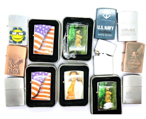 Thirteen modern windproof lighters, each with different designs, five of which are boxed. P&amp;P Group 2 (£18+VAT for the fi