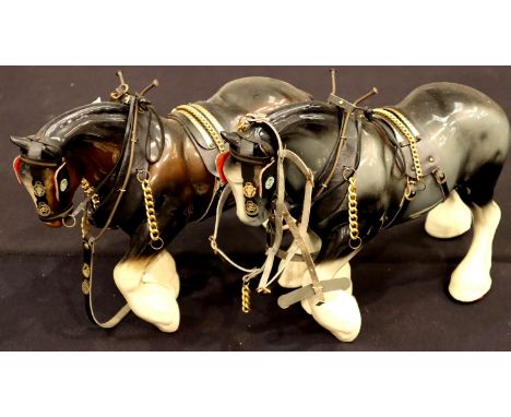 Two large ceramic shire horses with leatherwork, each L: 38 cm. Not available for in-house P&amp;P, contact Paul O'Hea at Mai