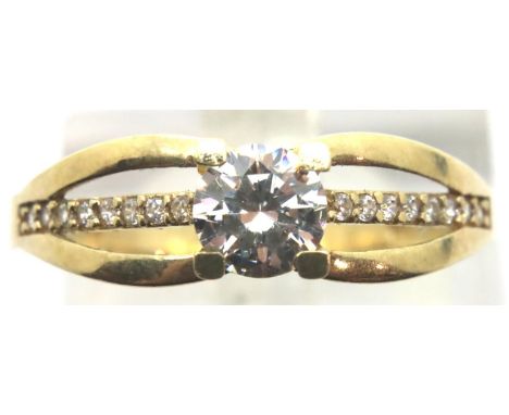 9ct gold solitaire ring with stone set shoulders, size P. P&amp;P Group 1 (£14+VAT for the first lot and £1+VAT for subsequen