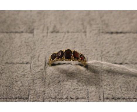 Ladies 9ct Gold Garnet Set dress ring of 5 stones Size R. 3g total weight 