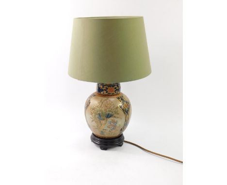 A Chinese pottery table lamp, with painted floral decoration, gilt edge, against a crackle ground, 46cm high.