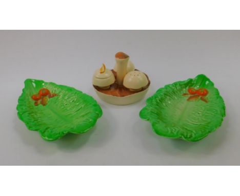 A Carltonware mushroom cruet, of three pieces with stand, and a pair of Carltonware leaf dishes, (3).