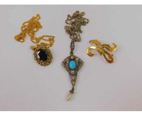 A 9ct gold and oval cut garnet pendant on chain, 6.8g, yellow brooch cast as the letter K, stamped 585, 2.1g, and an Art Nouv