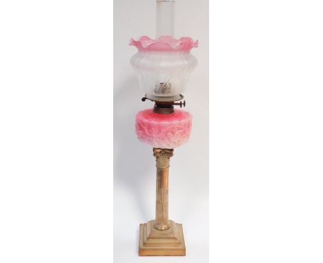 An Edwardian Corinthian column silver plated oil lamp, with Duplex burner and moulded pink glass reservoir and acid etched Ar