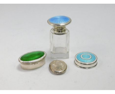 An Edward VII silver and green guilloche enamel oval pill box, Birmingham 1909, silver and turquoise blue guilloche enamel to