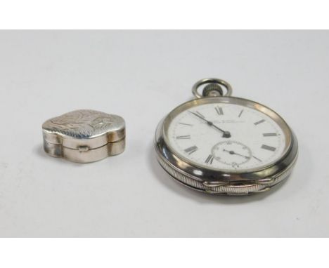 A silver serpentine pill box, with foliate engraving, Birmingham 1984, together with a gentleman's silver cased pocket watch,