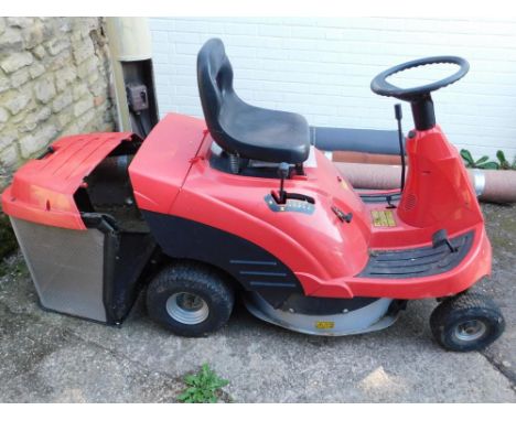A Honda HF1211 ride-on lawnmower, with operators manual and owners manual.