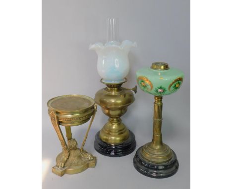 A brass oil lamp, with opaque glass shade, 37cm high, a brass oil lamp with reeded column and painted green glass reservoir a