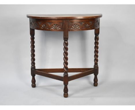 An Edwardian Oak Demilune Console Style Table with Barley Twist Supports, 77cms Wide 