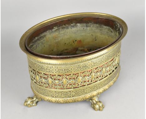 A Late 19th Century Pierced Brass Oval Planter with Four Claw Feet Having Copper Liner, 30cms Wide and 17.5cms High 