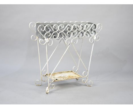 A White Painted Wrought Iron Plant Stand with Stretcher Shelf, 73x68cm high 