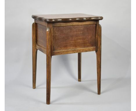An Edwardian Lift and Twist Games Table with Oval Playing Surface and Four Dished Coin Wells, 72cms Wide When Open 